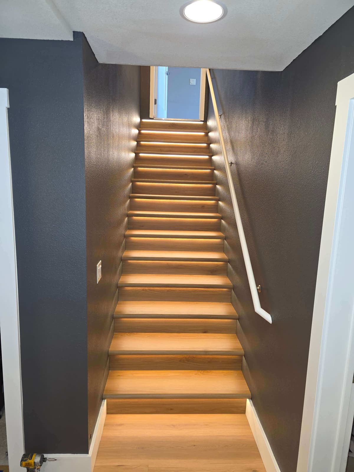 Clean flooring transitions and stair finishing detail