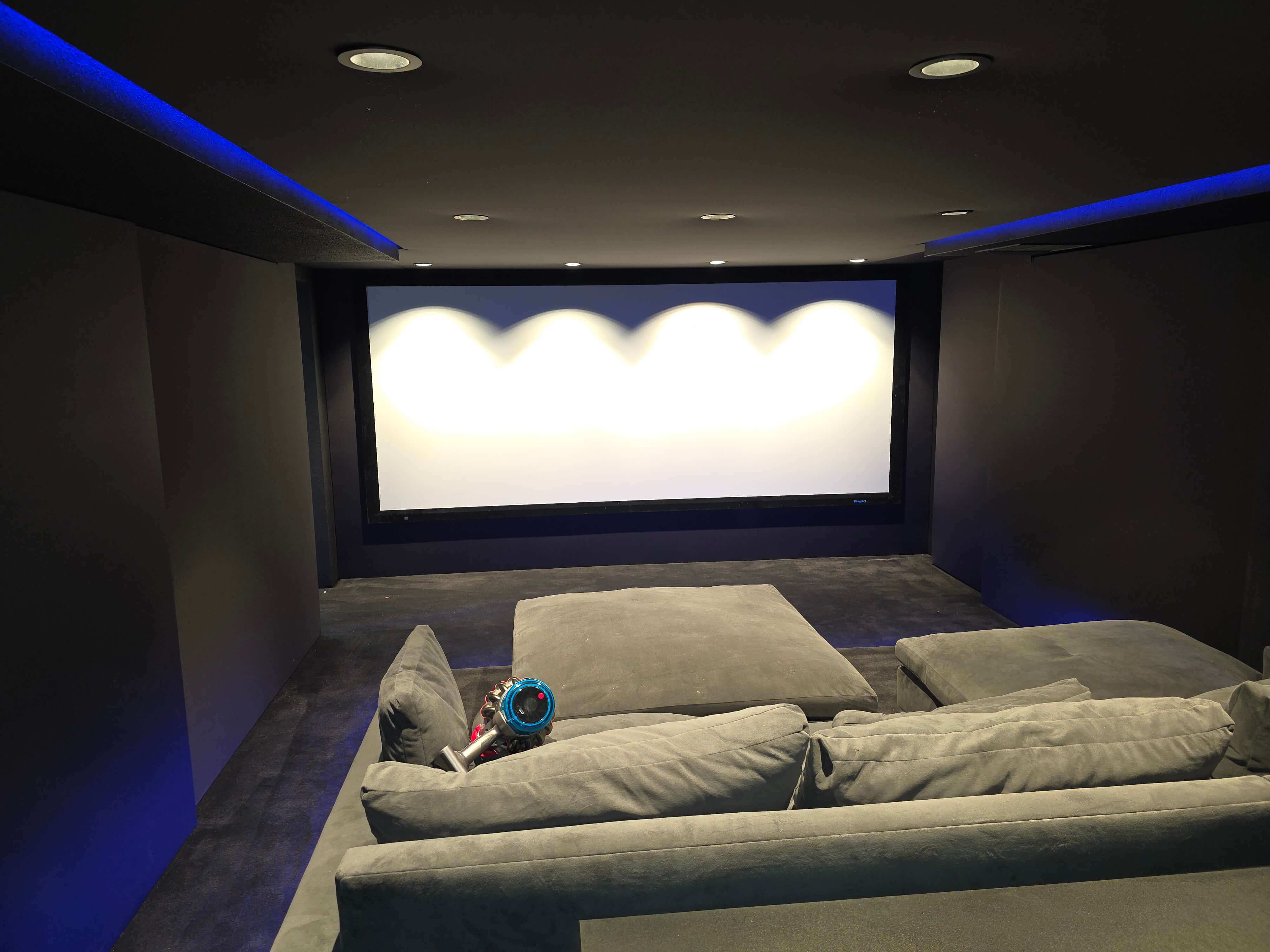 Home theater installation in Spokane, WA with large screen and clean built-ins