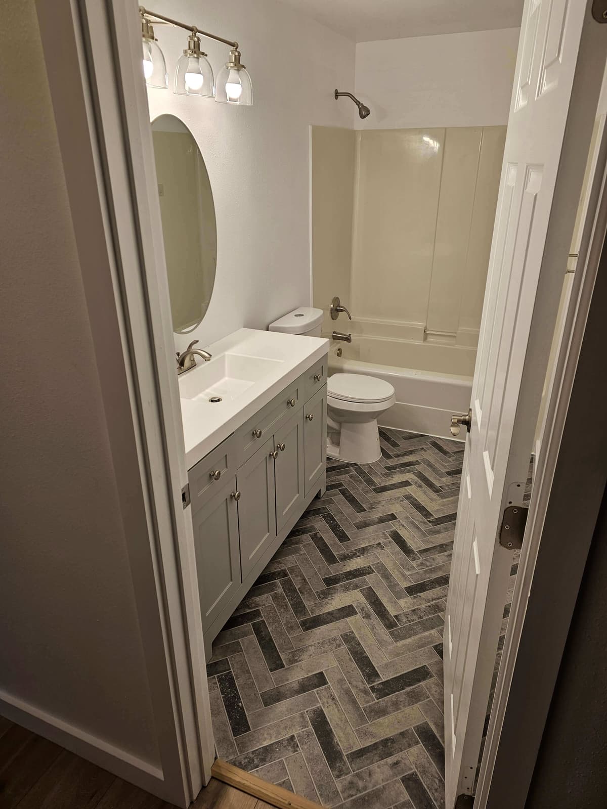 Kitchen tile backsplash installation with precise cuts and alignment